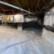 shows vapor barrier with wrapped piers done during encapsulation on Ridgefield Rd project in Chapel Hill 