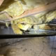 crawlspace with no vapor barrier and falling insulation found during inspection on Westbury Ct during inspection