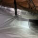 crawlspace floor and walls wrapped and sealed with vapor barrier for encapsulation on Howson Rd in Raleigh