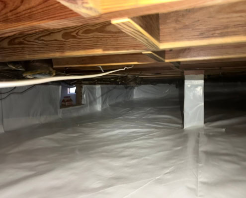 properly installed vapor barrier and wrapped piers for encapsulation project in Cary