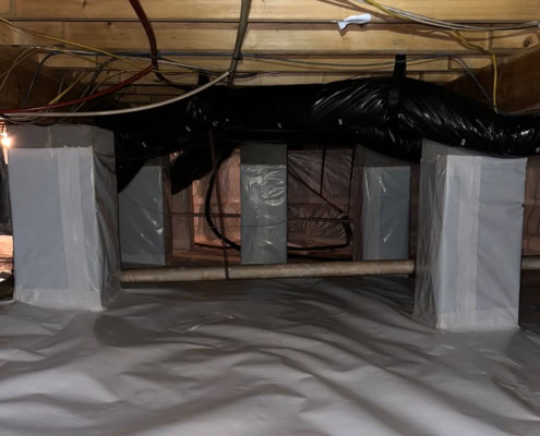 vapor barrier installed covering crawlspace ground and piers on Ridgebury Rd in Raleigh