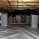 vapor barrier installed covering crawlspace ground and piers on Ridgebury Rd in Raleigh