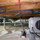 encapsulated crawlspace on Rippling Stream Rd in Durham showing dehumidifier and sealed vapor barrier 